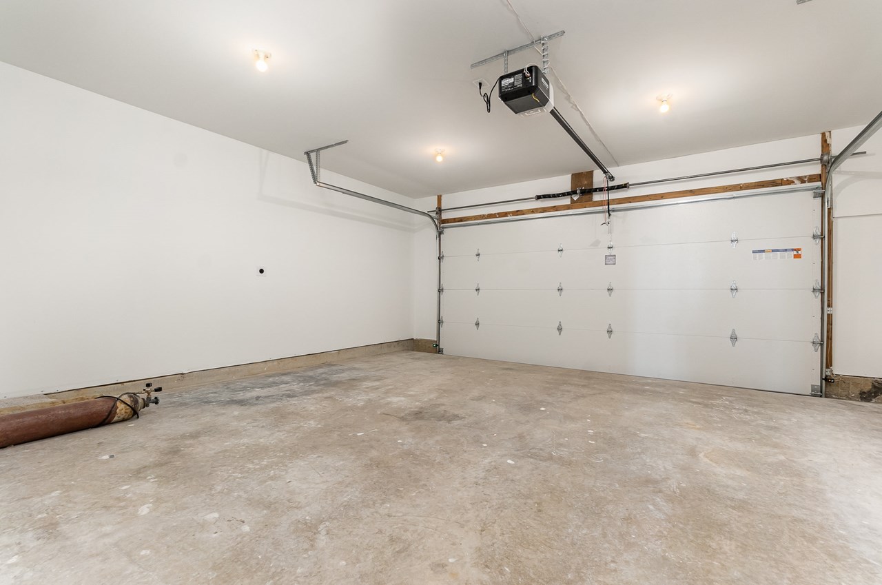 spacious 2 car garage with opener