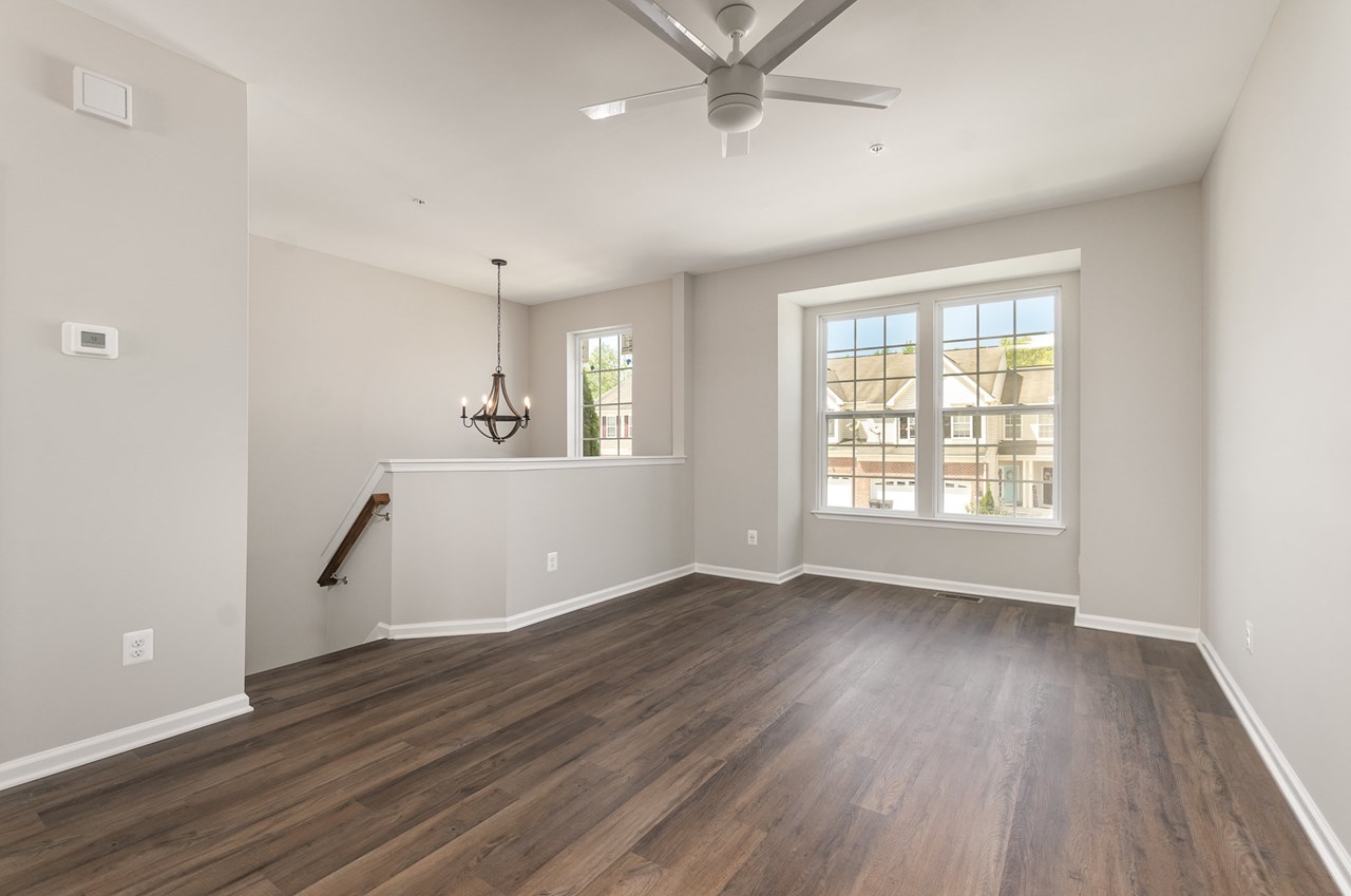 living room with new luxury vinyl floors, windows & paint