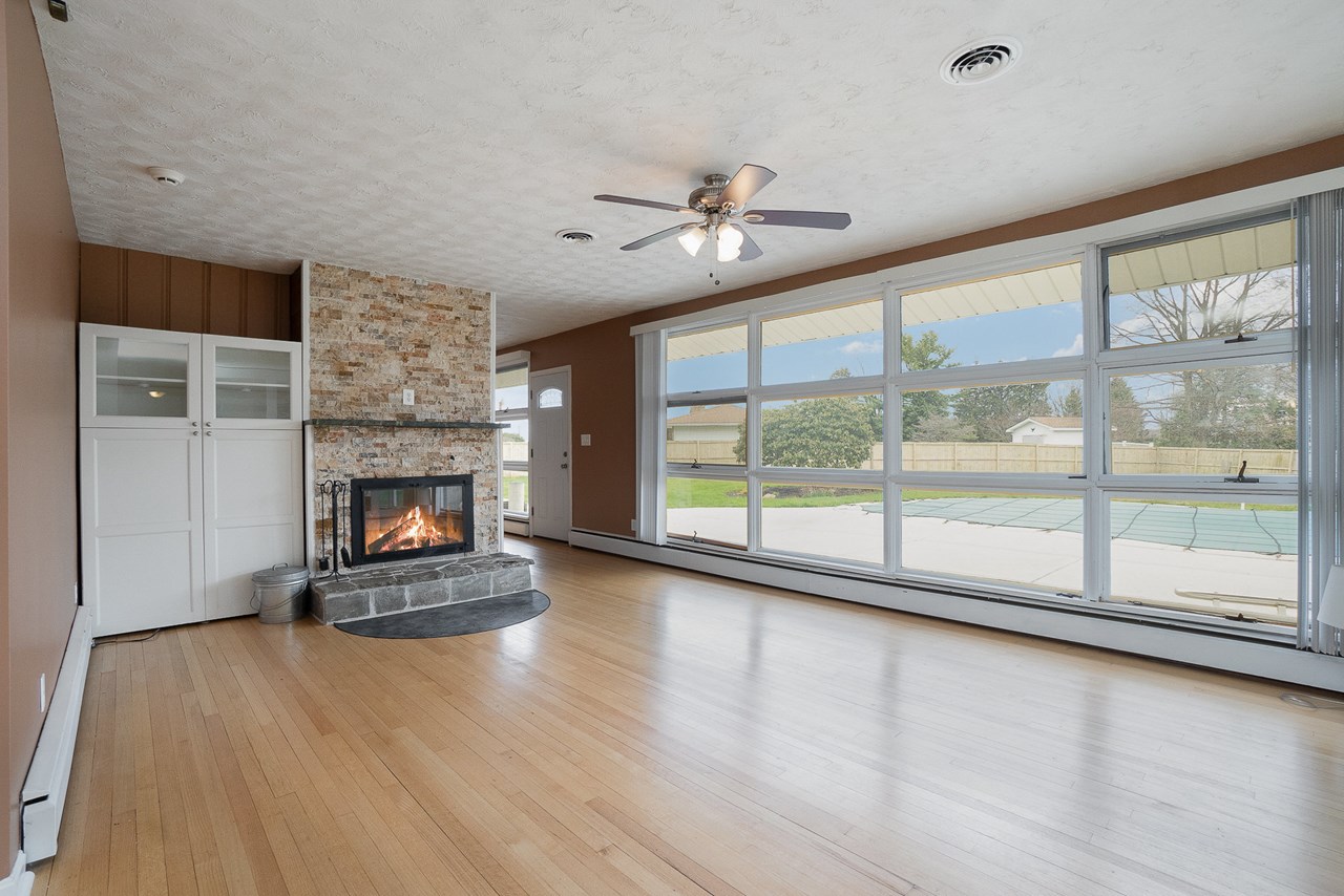 living room with wall of windows