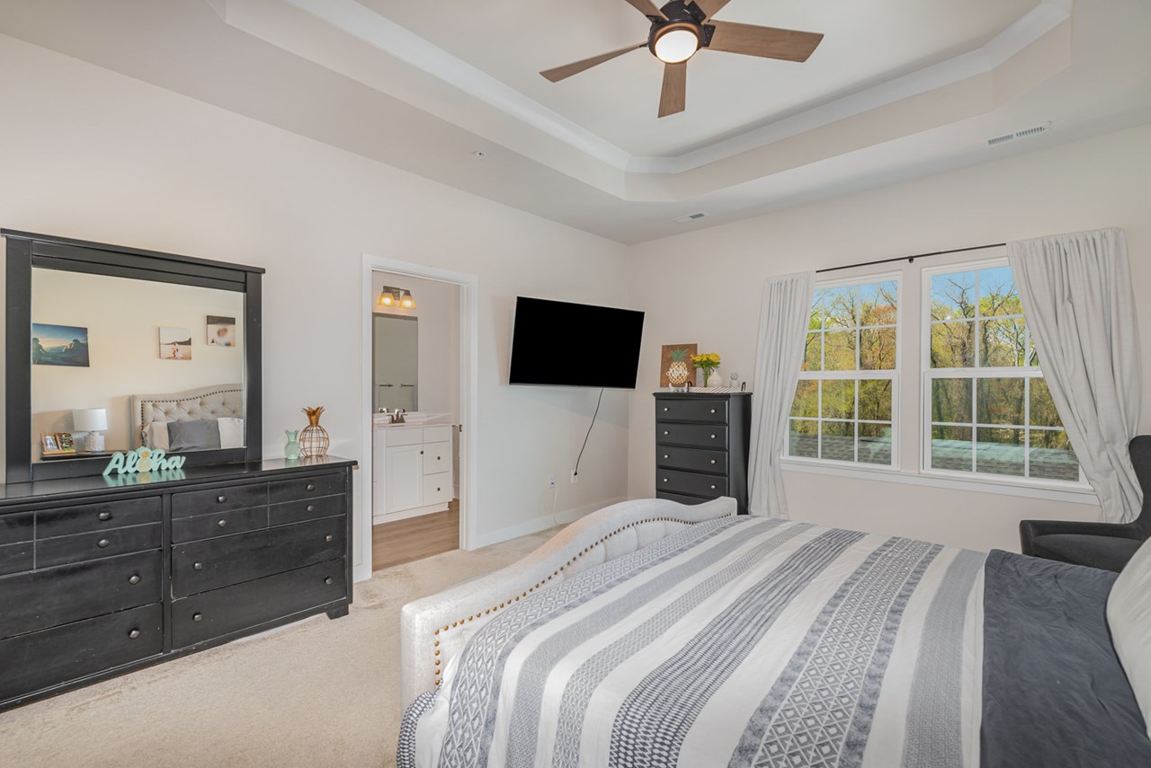 primary bedroom with ceiling fan