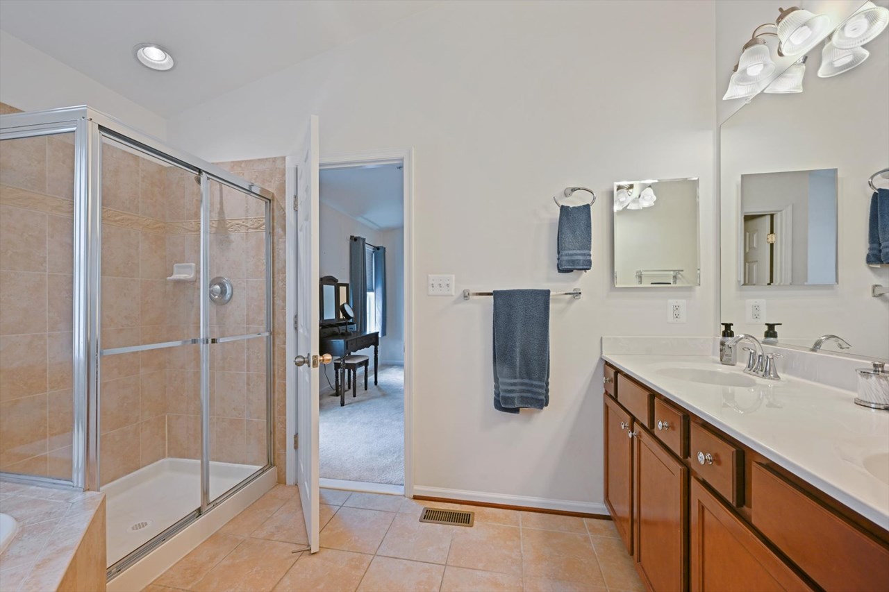 primary bathroom with separate shower & soaking tub