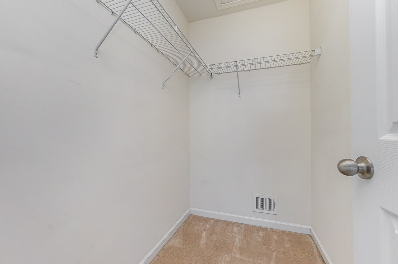 primary bedroom with walk in closet & separate bath