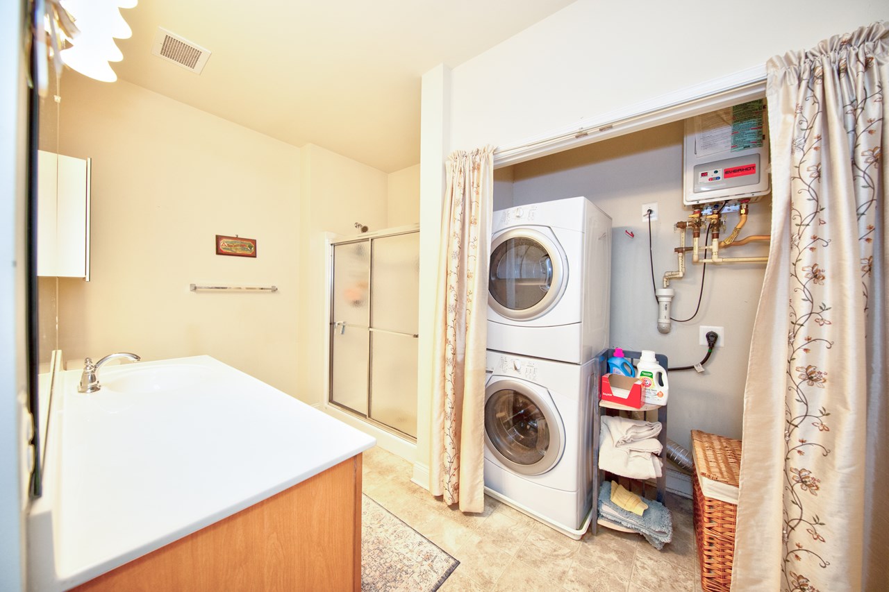primary bathroom with washer/ dryer