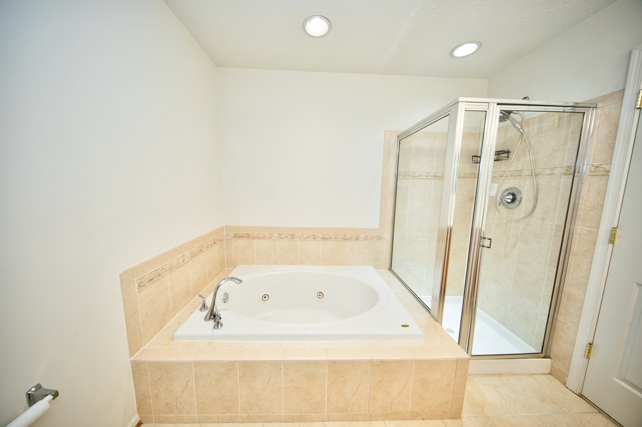 primary bathroom with soaking tub & shower