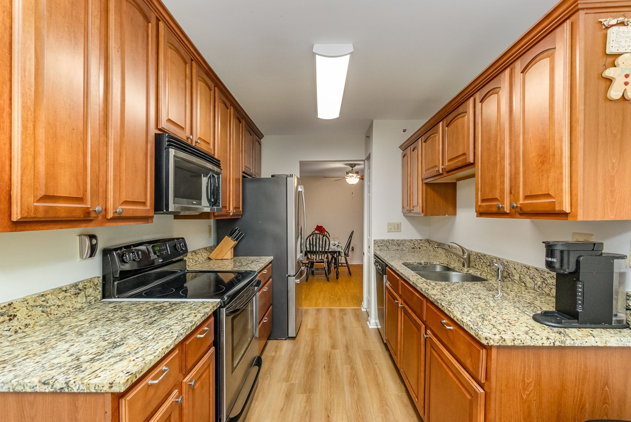 kitchen with all ss appliances & granite counters