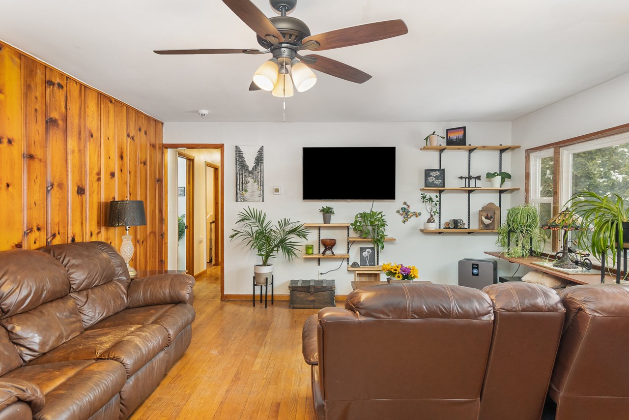 living room with ceiling fan