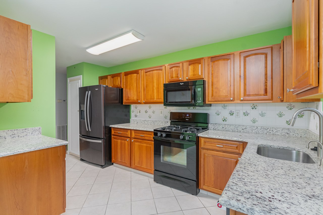 kitchen with all appliances  & granite counter tops