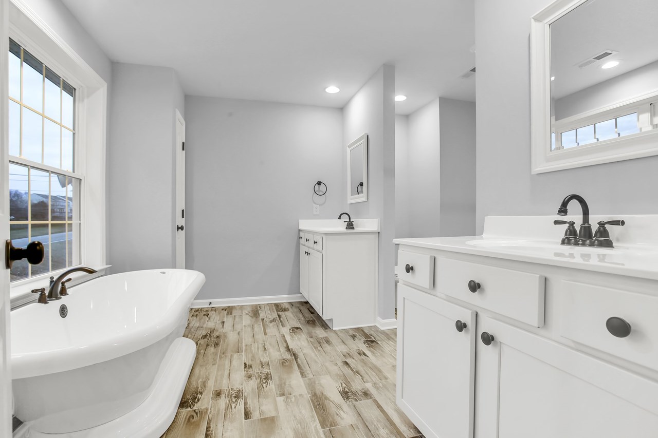 primary bath with double sinks & soaking tub