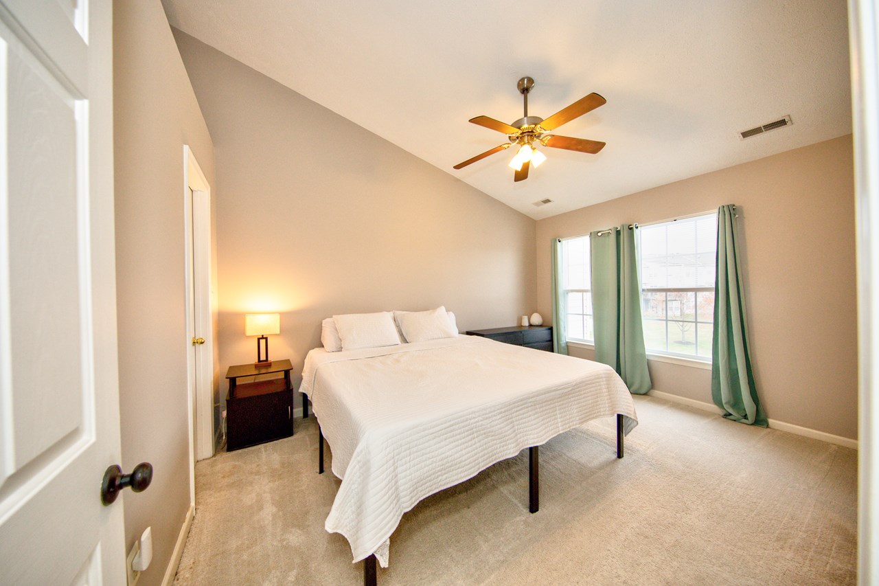 primary bedroom with walk in closet