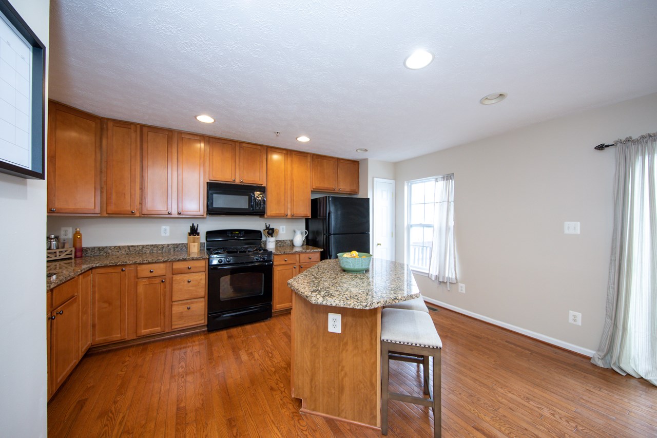 kitchen with granite appliances & deck access