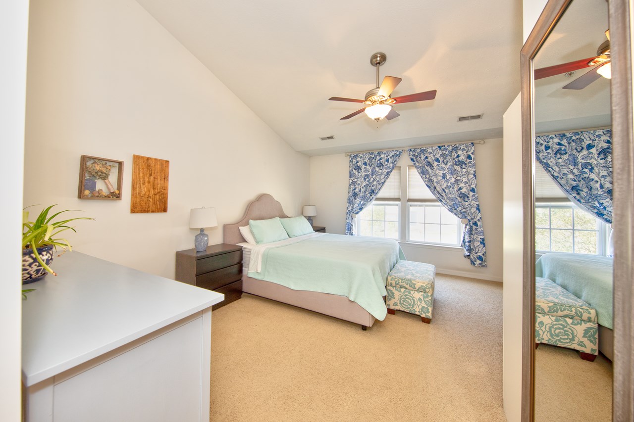 primary bedroom with 2 closets & separate bath