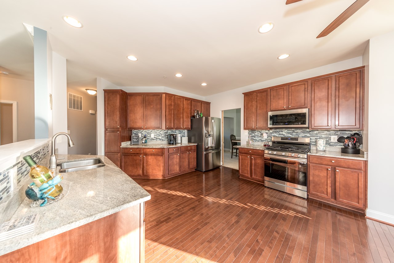 open kitchen with ss appliances & granite