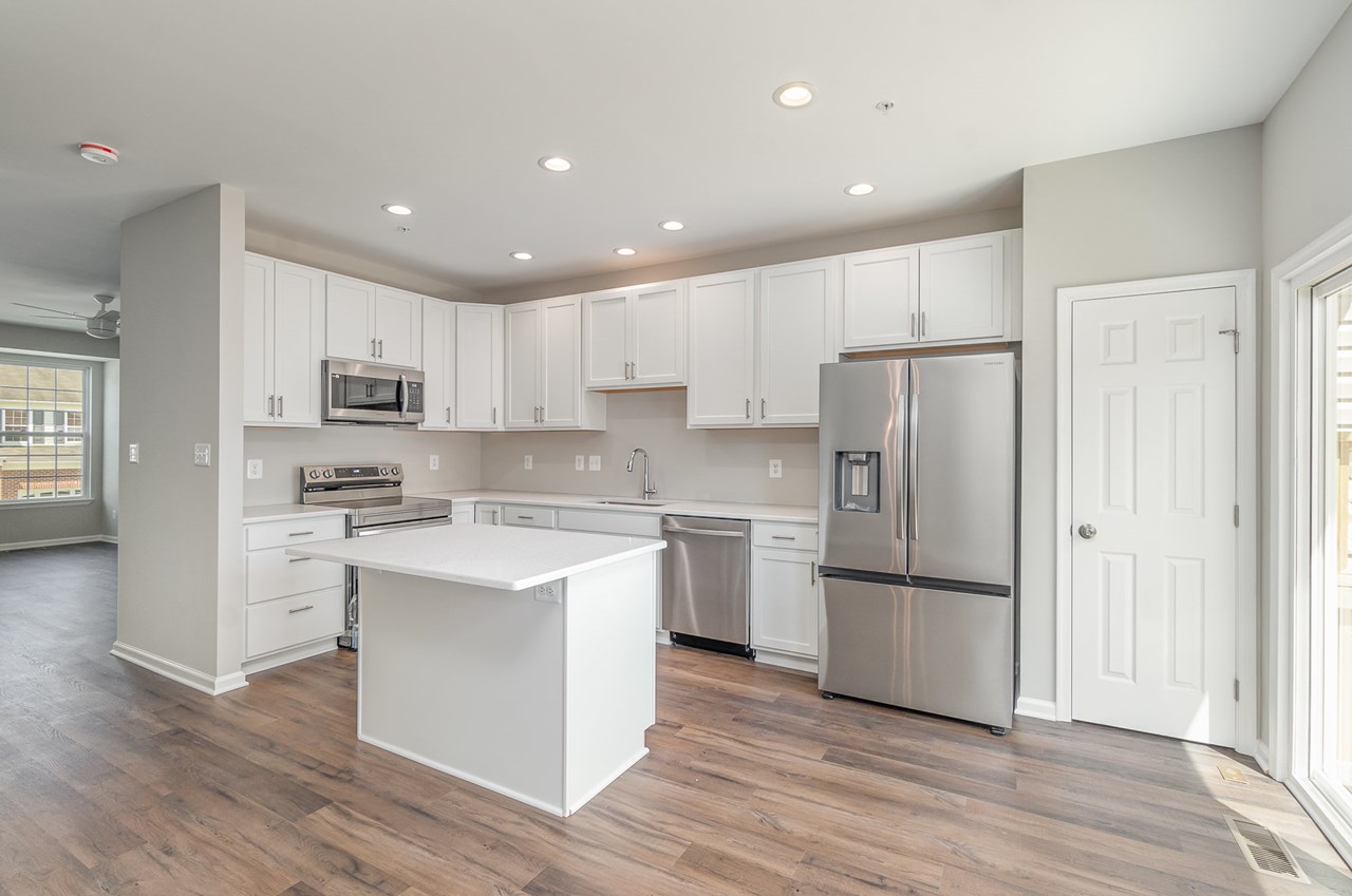 kitchen with new appliances, cabinets & island