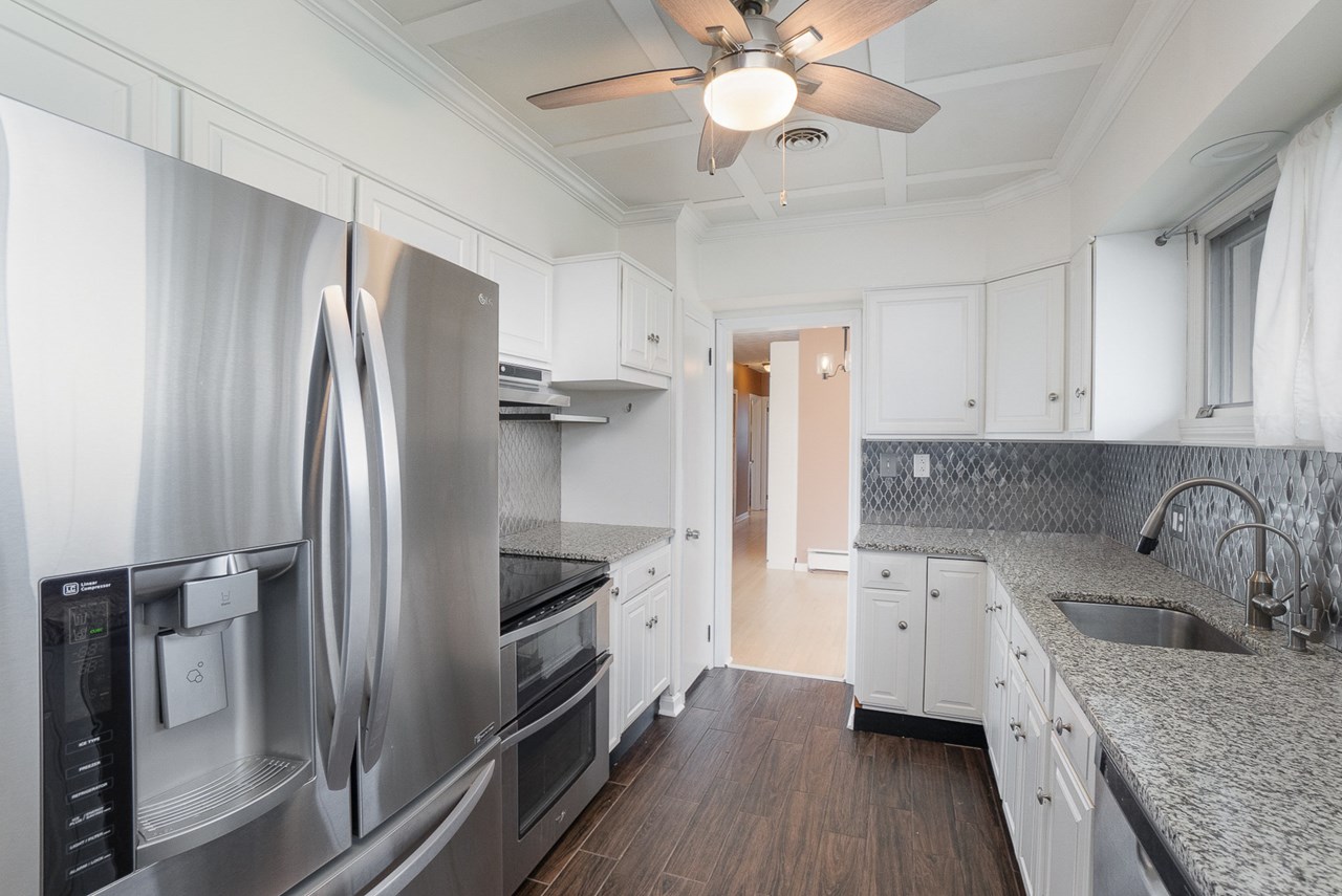 kitchen with granite counters & backsplash