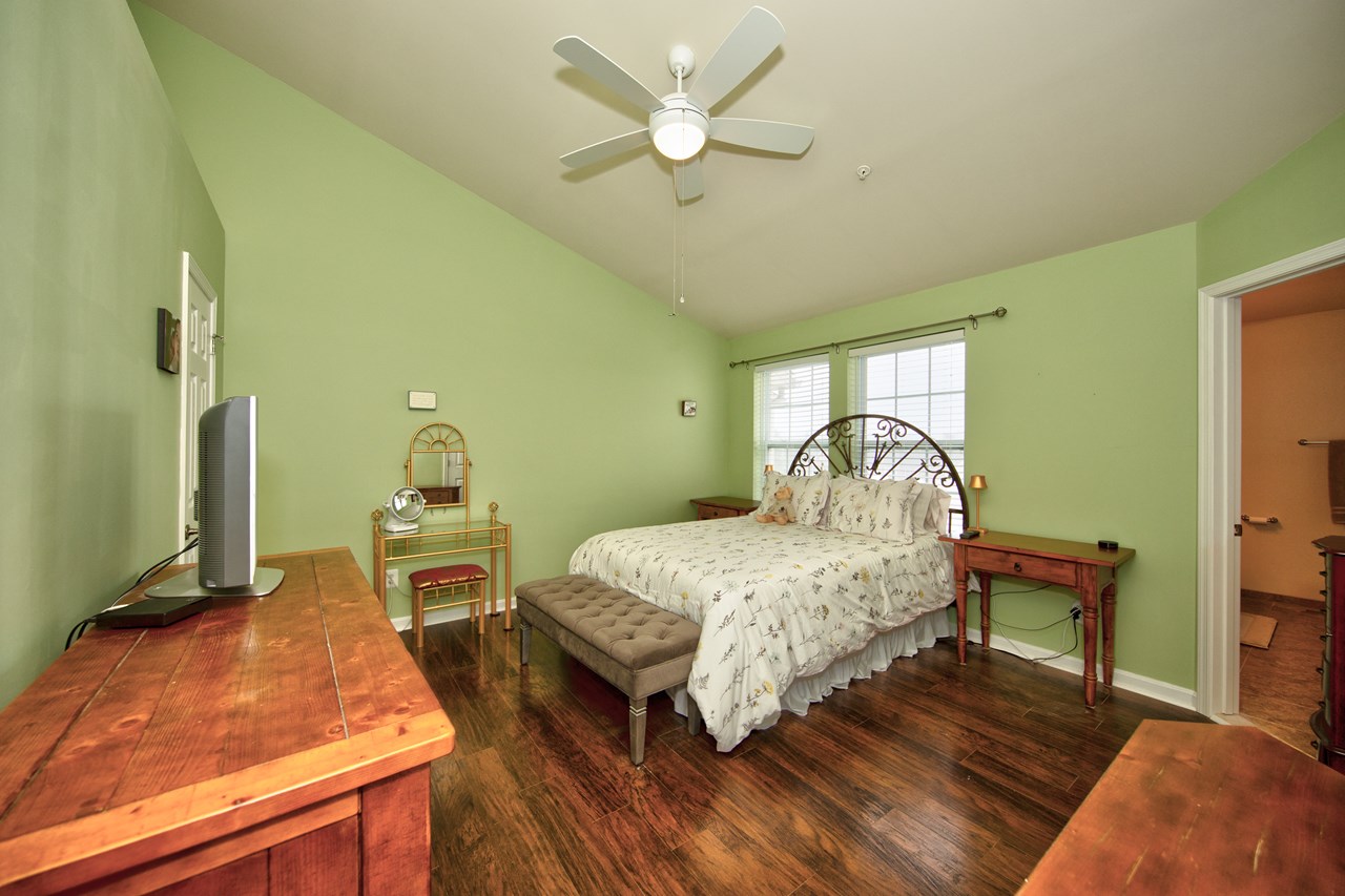 primary bedroom with ceiling fan