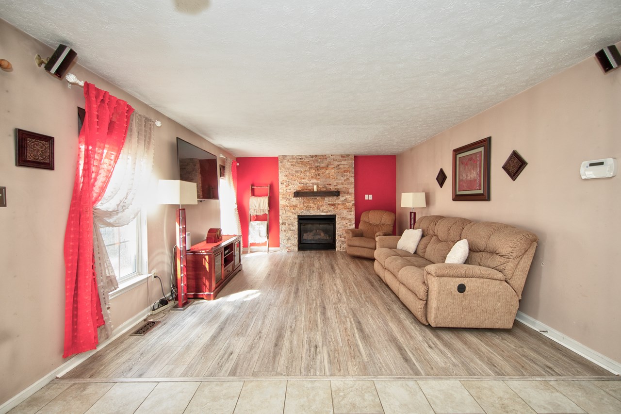 family room w/ gas fireplace & access to screened porch