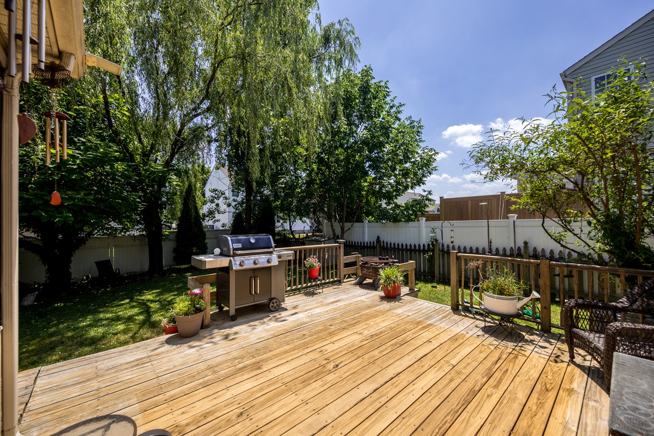 spacious rear deck overlooking backyard