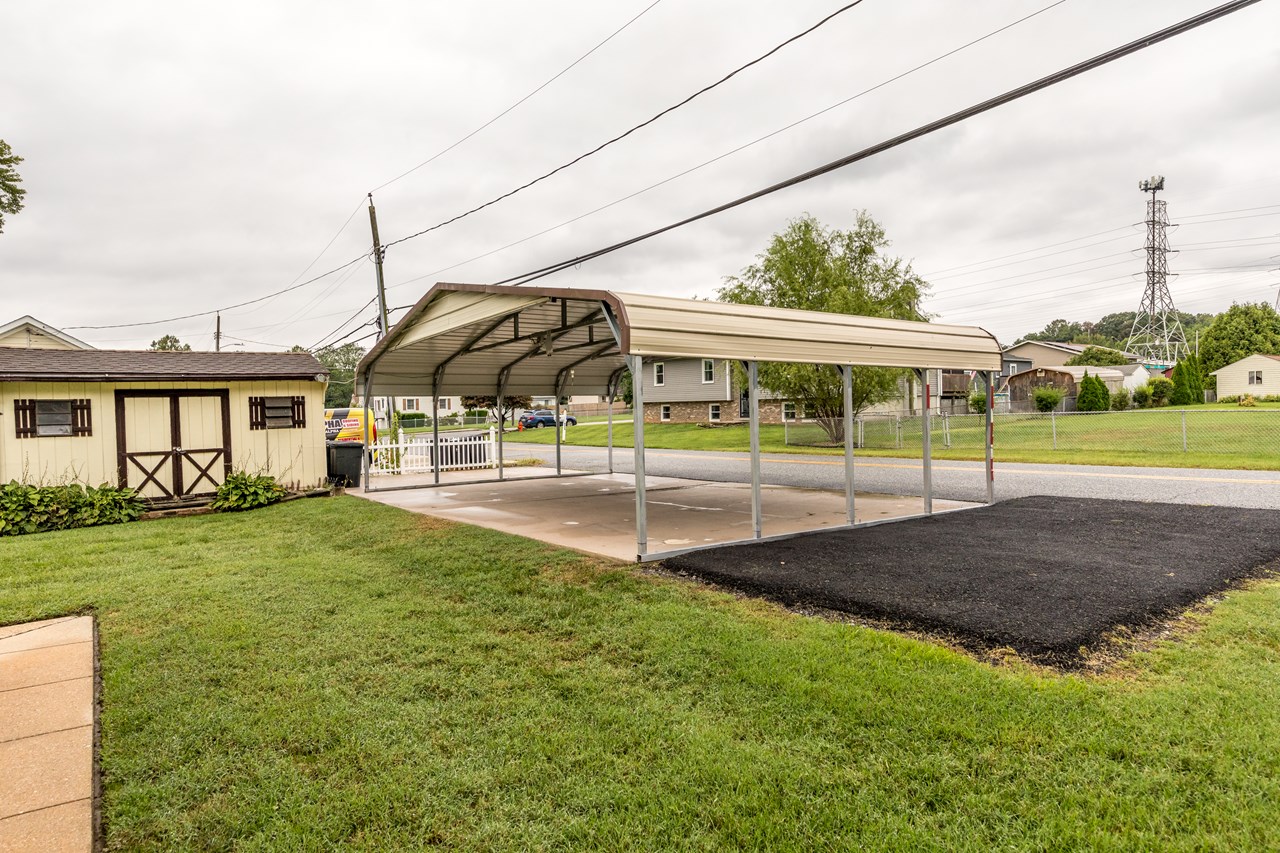 large car port & parking pad for 5 cars