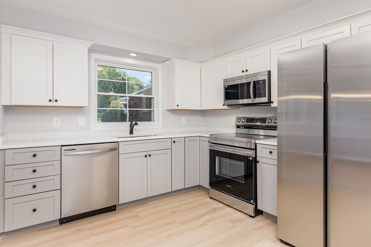 kitchen with brand new quartz counter tops