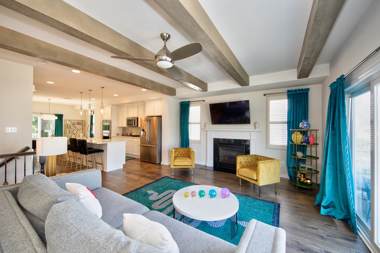 living room with gas fireplace & sliders to deck