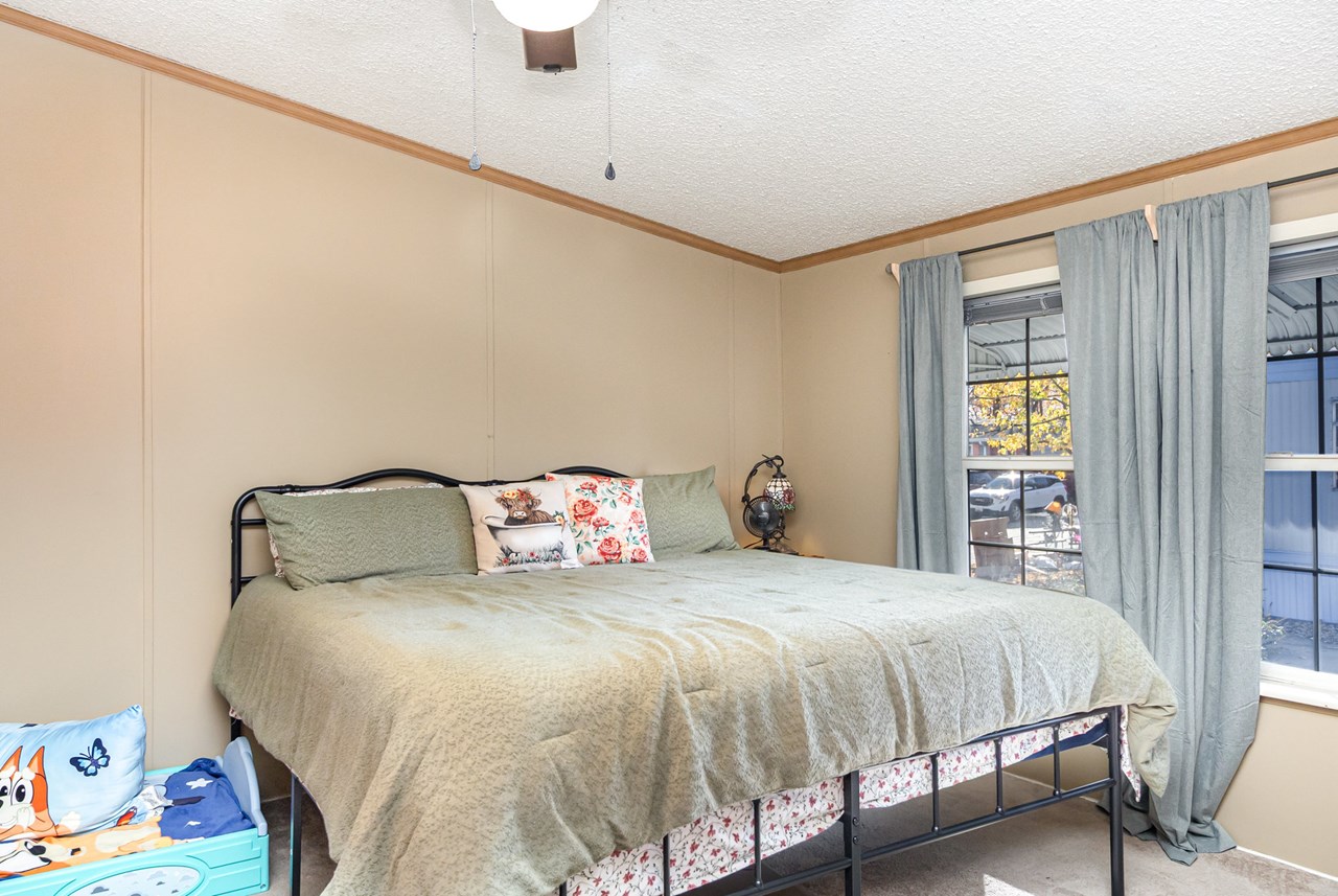 primary bedroom with walk in closet