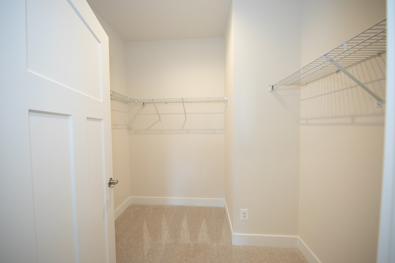 large primary bedroom walk in closet