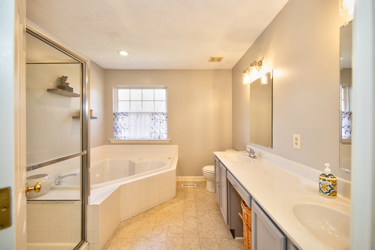 primary bathroom with soaking tub & separate shower