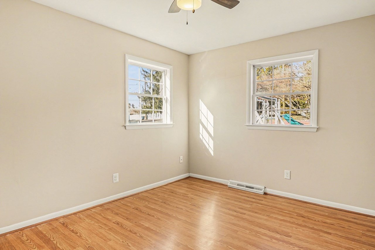 primary bedroom with ceiling fan