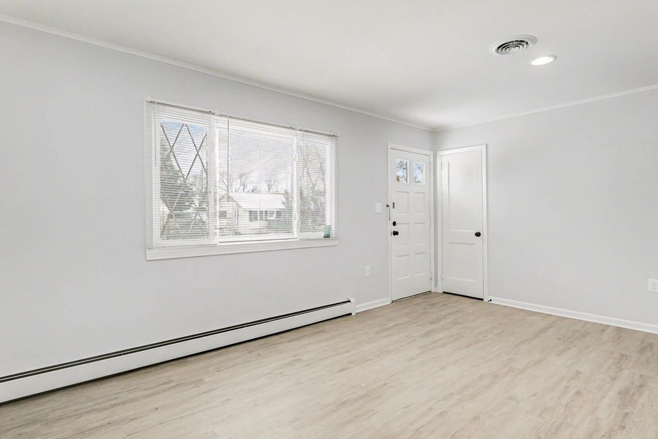 entrance to large living room with new floors