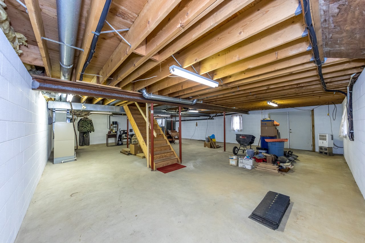 unfinished lower level with walk out to rear yard & central vac