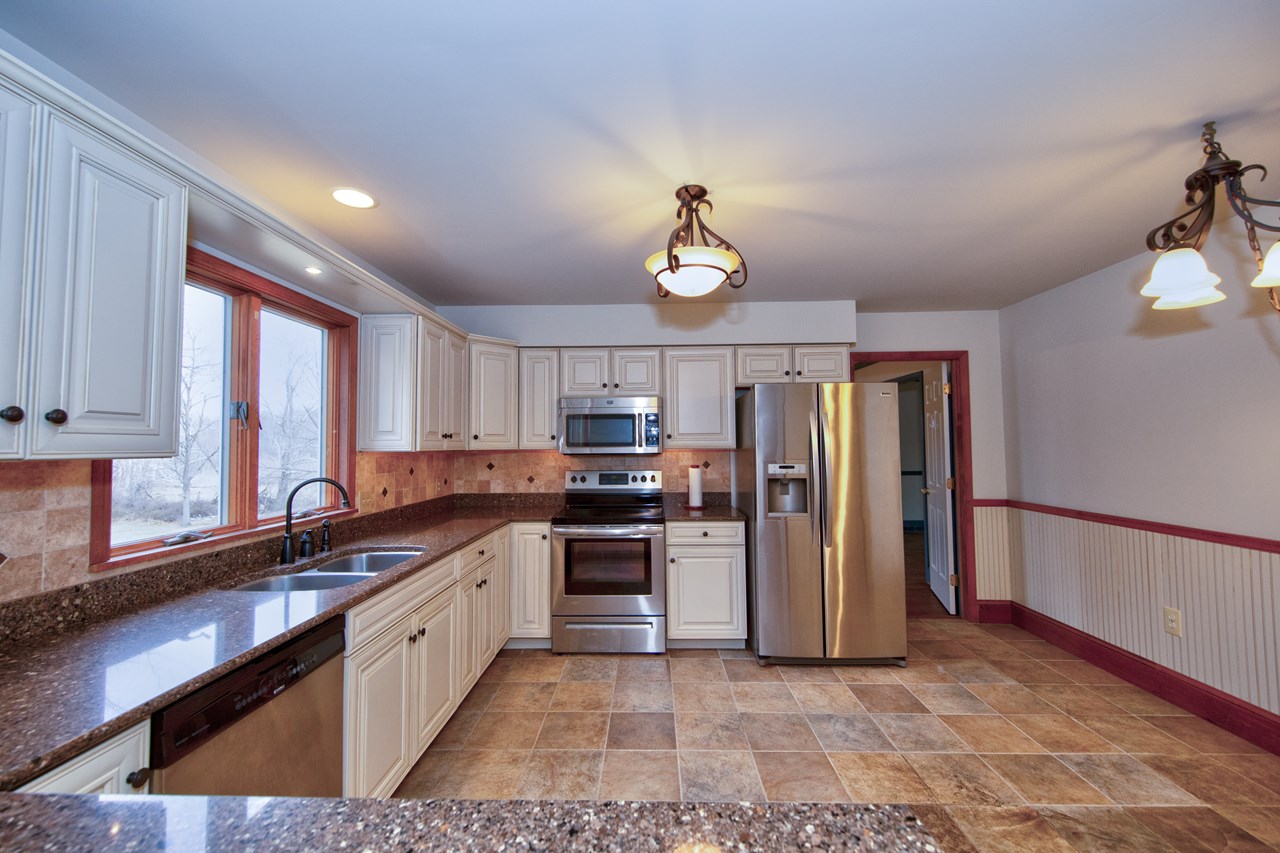kitchen with large window to overlook rear yard