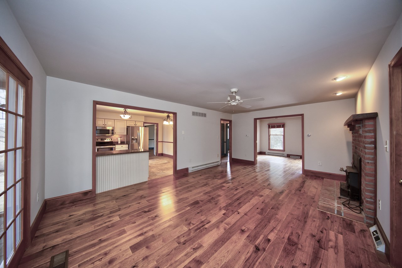 family room with wood burning fireplace and porch access