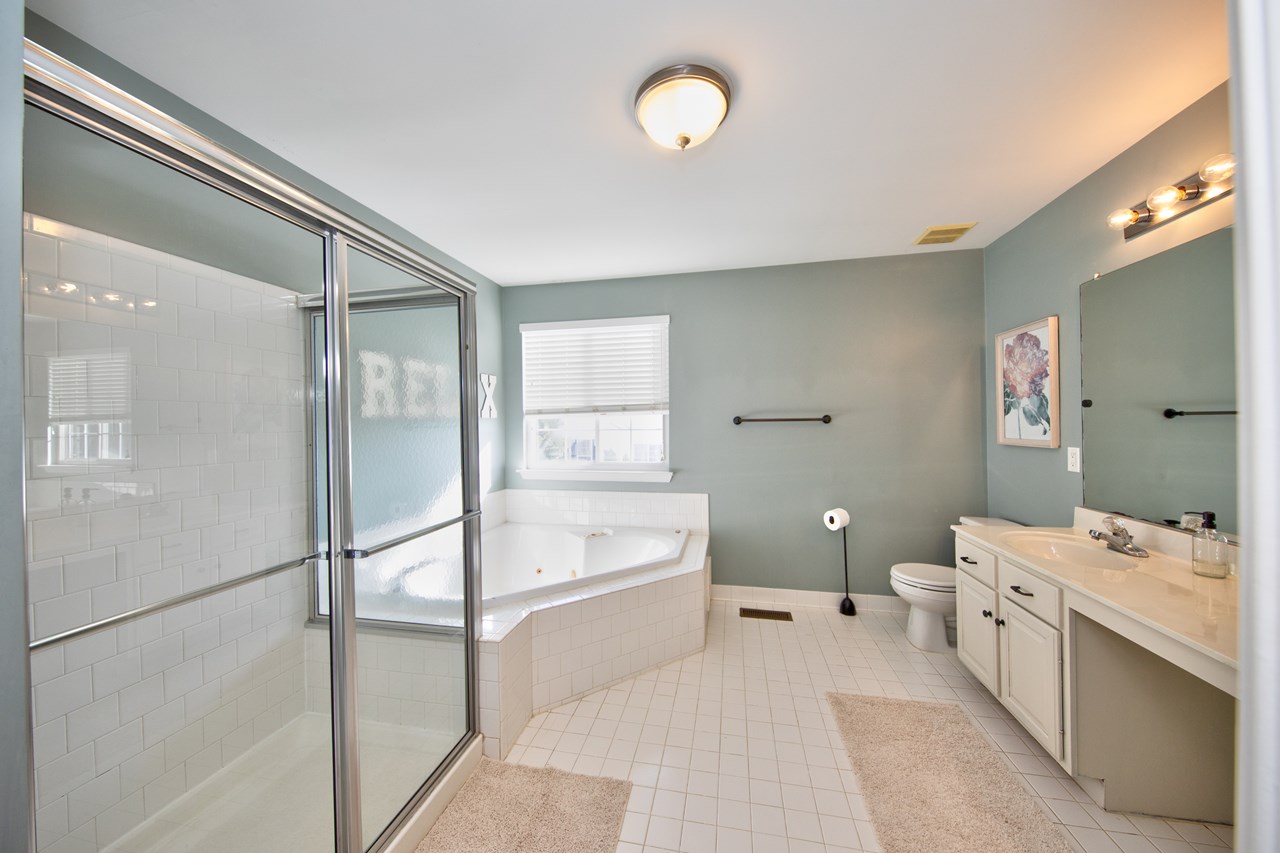 primary bathroom with double sinks & soaking tub