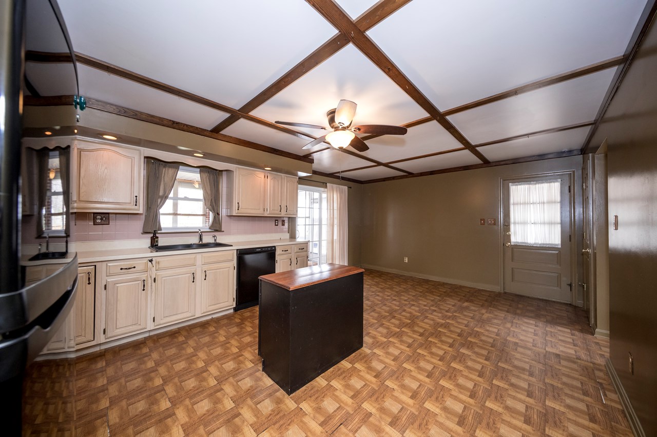 kitchen with table space & driveway access (side)