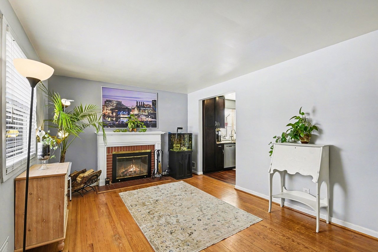 living room with brick surround heath fireplace
