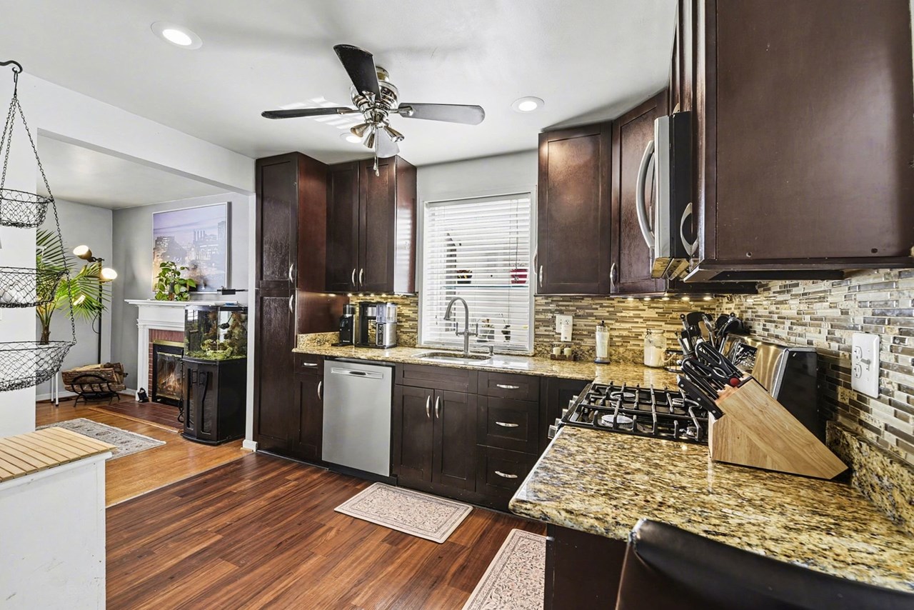 kitchen with granite countertops & ceiling fan
