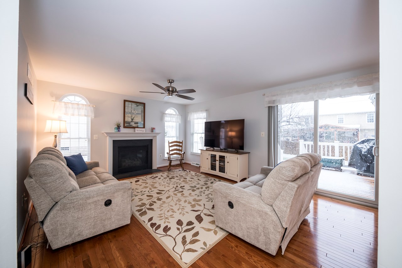 family room with gas fireplace & deck access