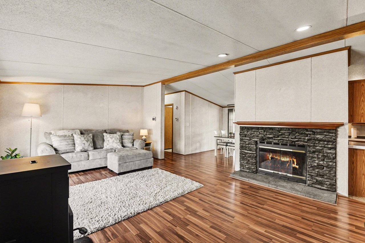 living room with wood burning fireplace