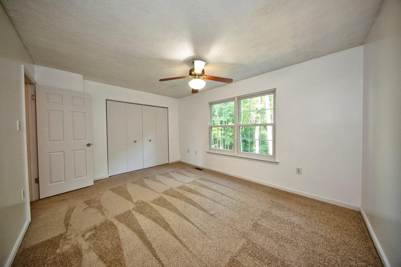 primary bedroom w/ new carpet & fresh paint
