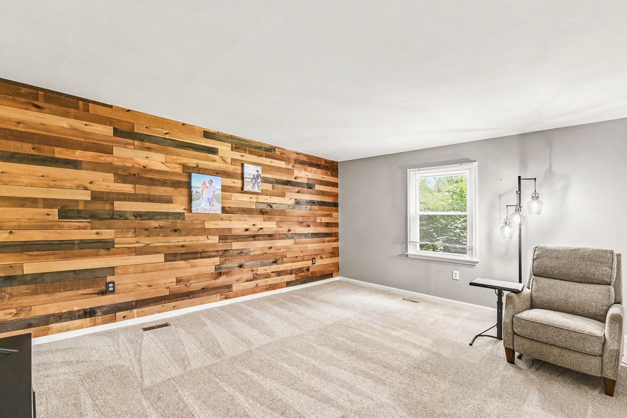 lower level family room with shiplap wall