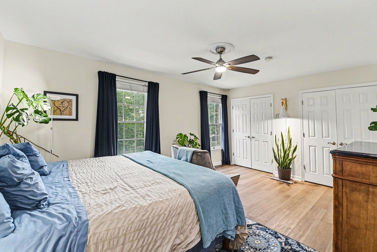 primary bedroom with ceiling fan