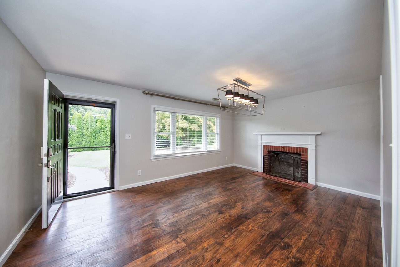 entrance to living room with fireplace