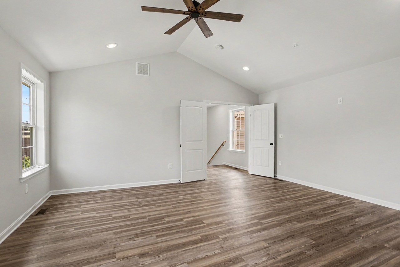 primary bedroom with vaulted ceilings