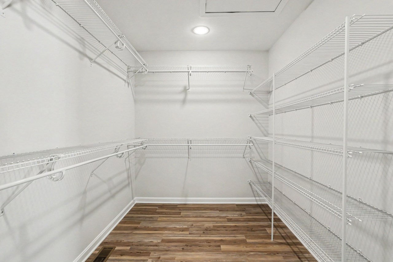 primary bedroom with walk in closet