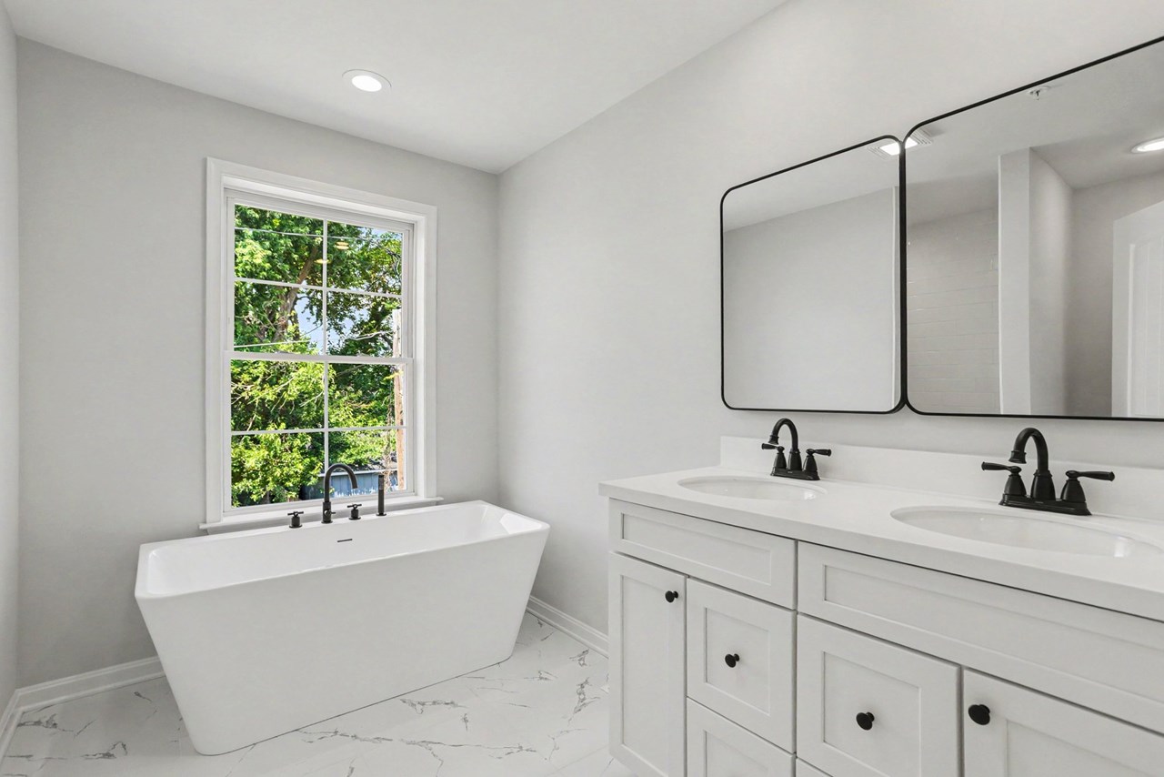 primary bathroom with double sink & soaking tub