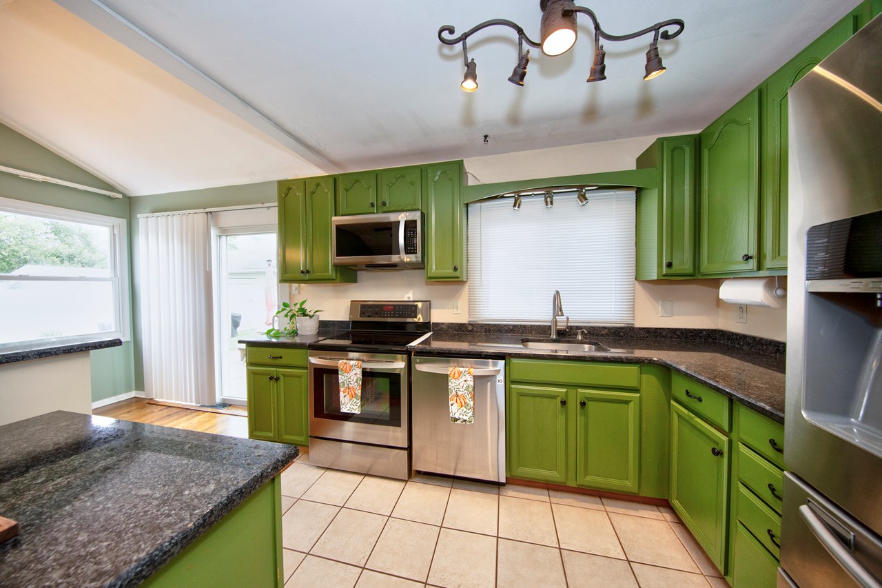 kitchen with granite countertops & ss appliances