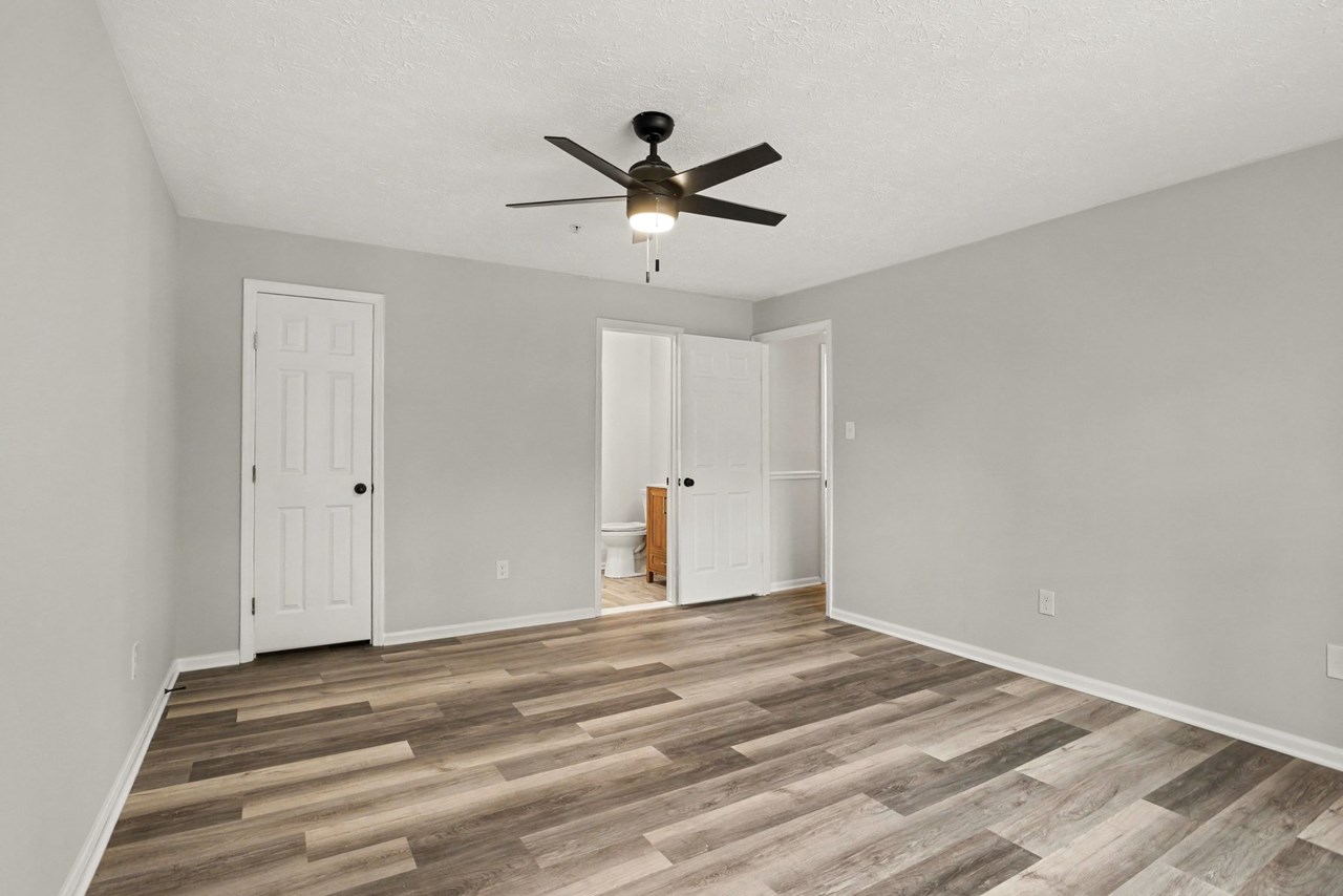 primary bedroom with large closet & full bath